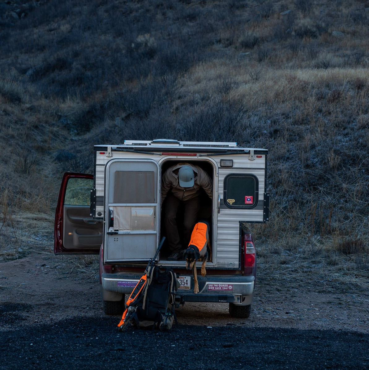 Van with open door in a mountainous landscape
