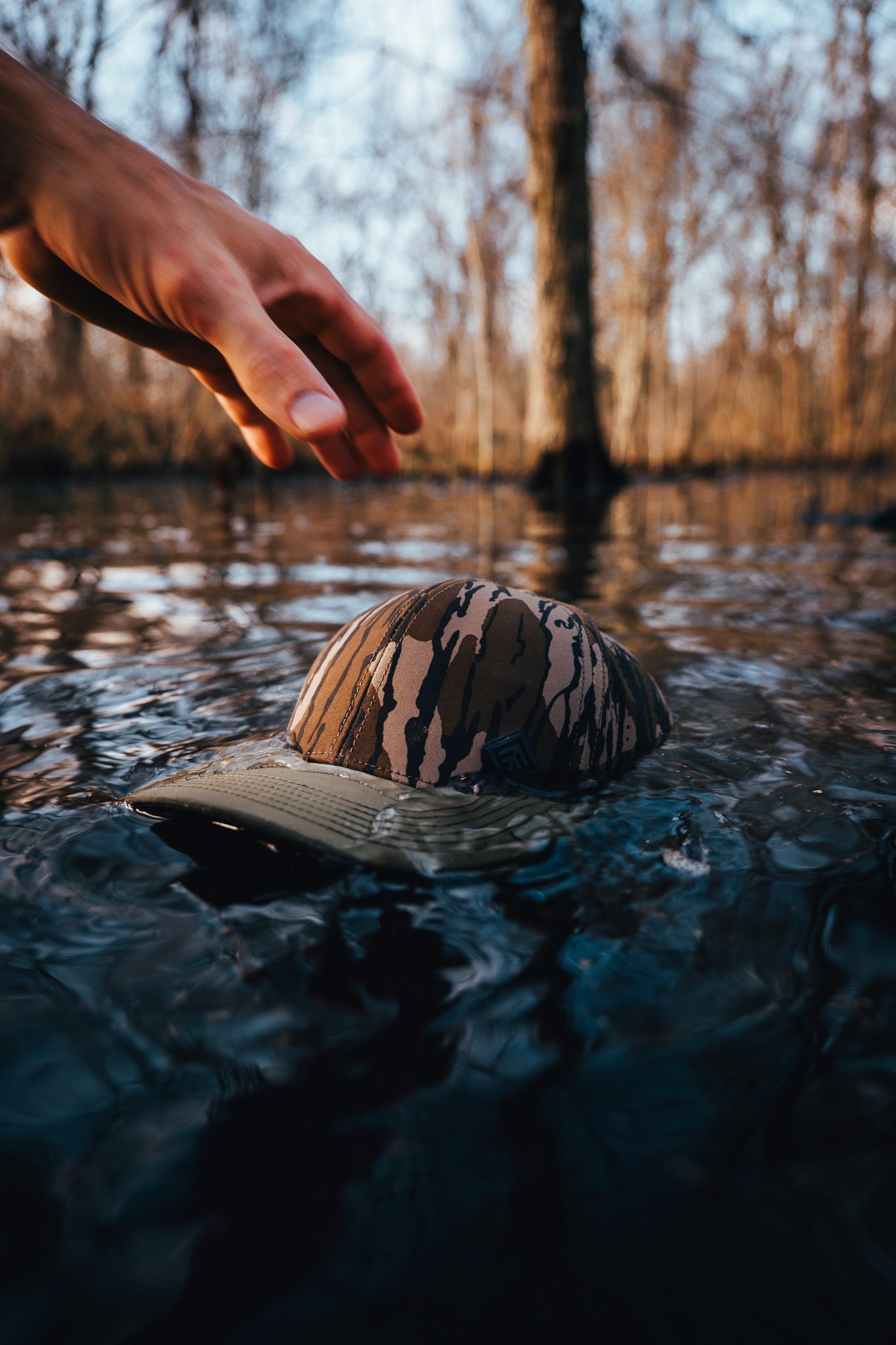 Camo hat floating on water outdoors
