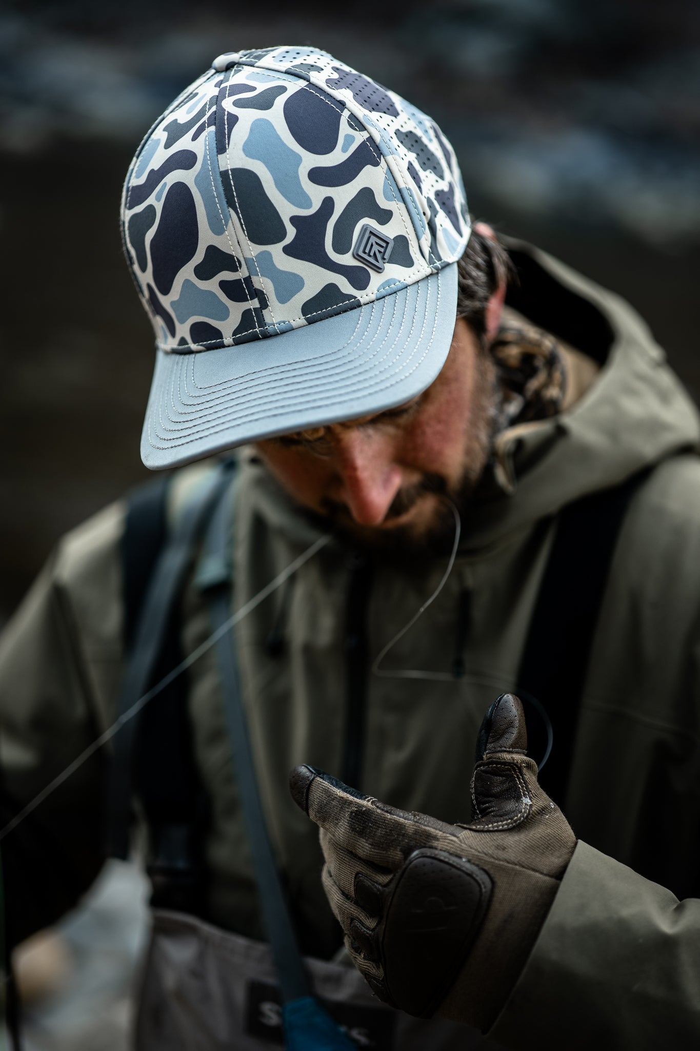 Fly fisherman wearing camo Terreno hat