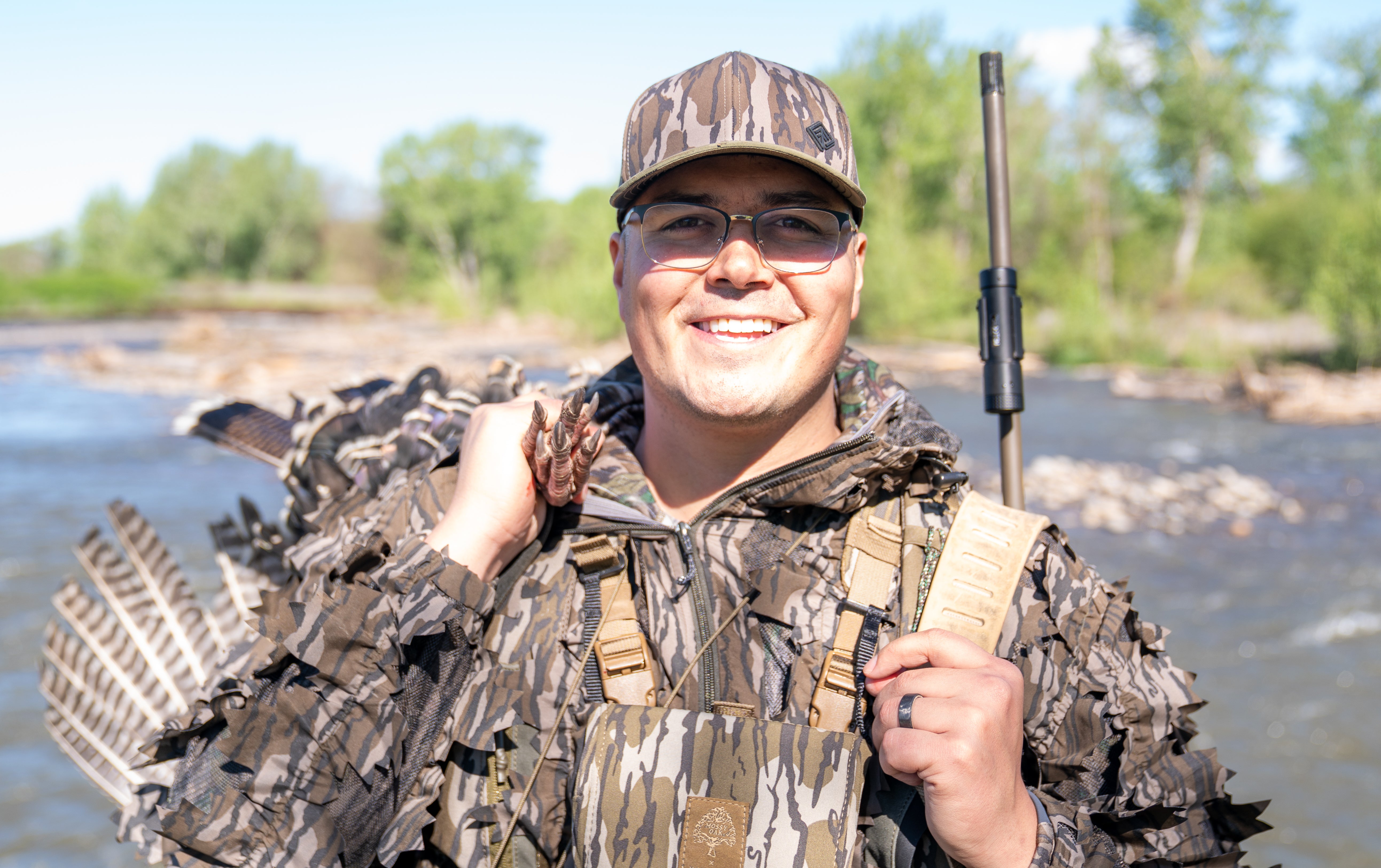 Smiling turkey hunter in camo hat